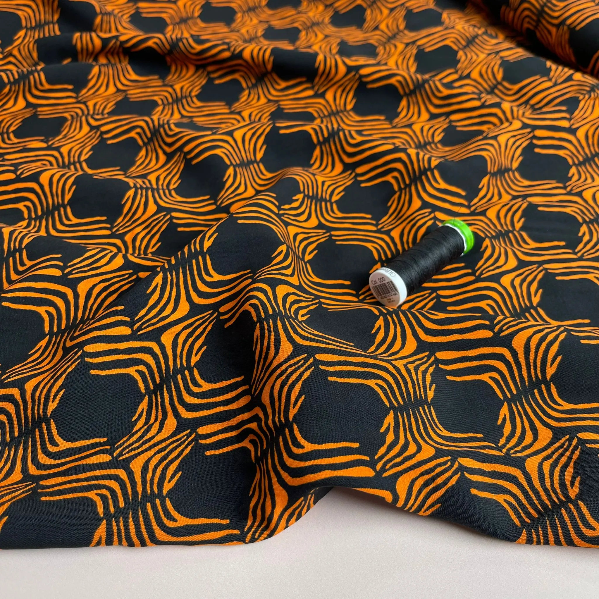 Abstract Lines in Orange on Black Viscose Poplin Fabric