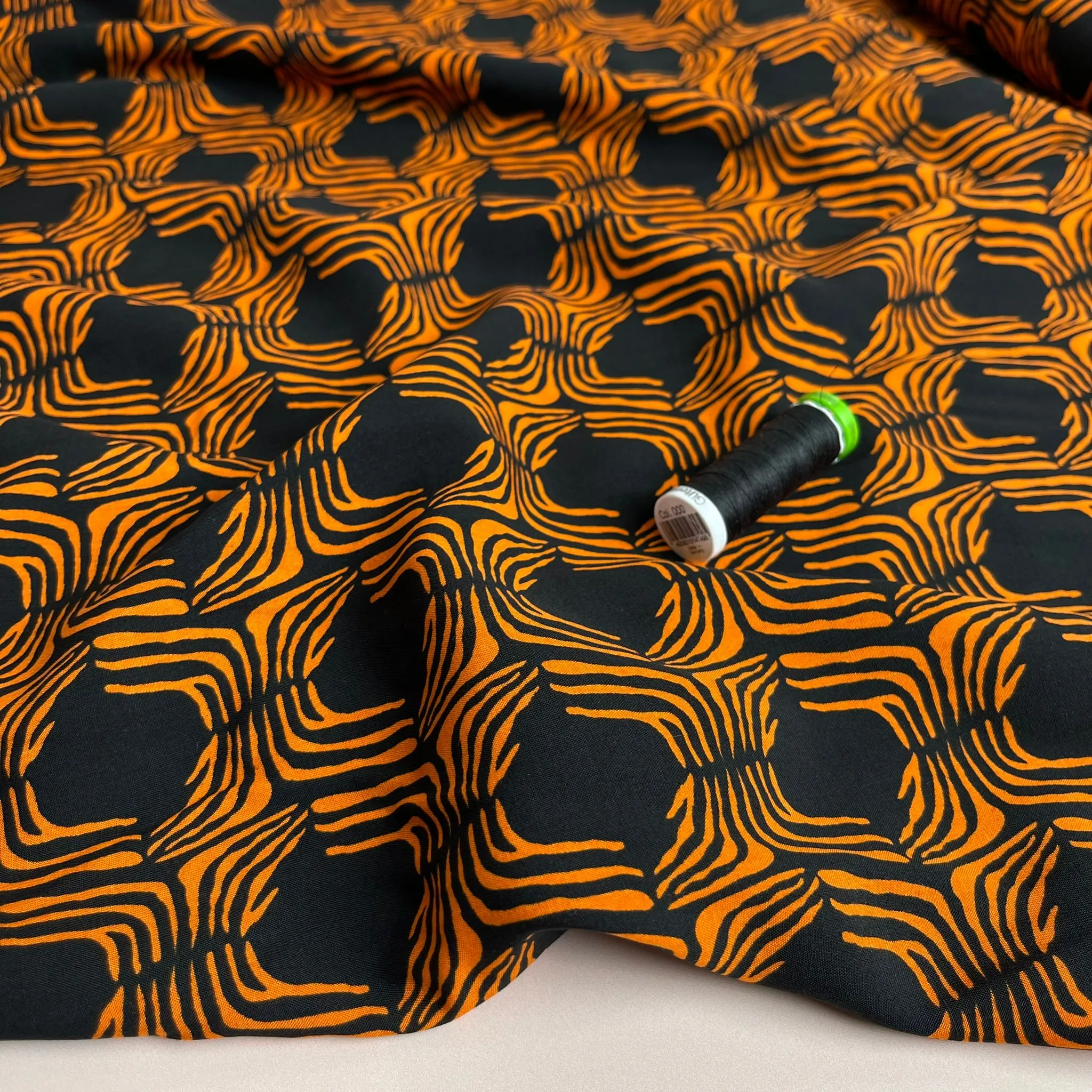 Abstract Lines in Orange on Black Viscose Poplin Fabric