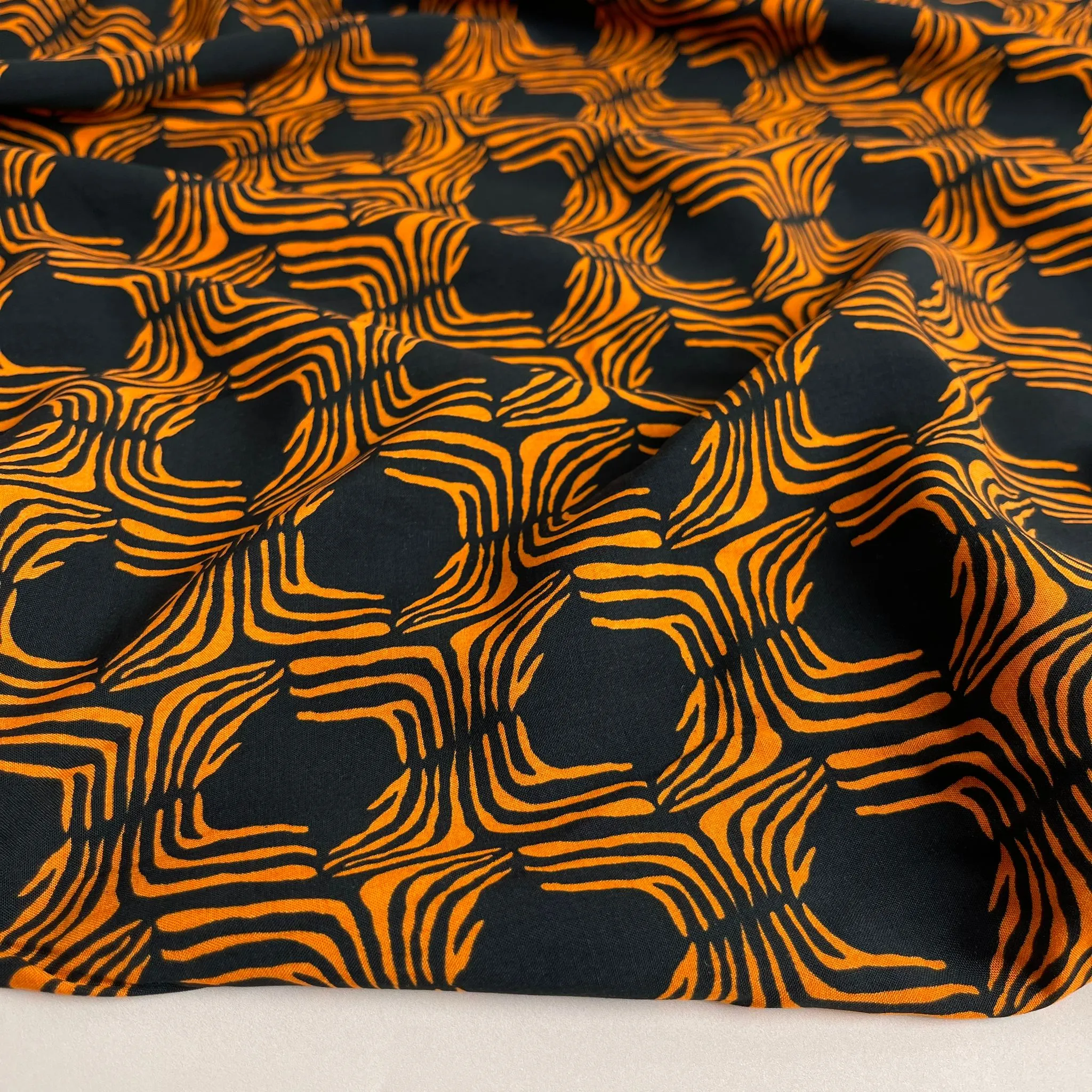 Abstract Lines in Orange on Black Viscose Poplin Fabric